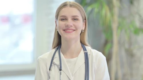 Smiling Doctor Wearing Stethoscope and White Coat