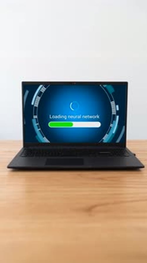Laptop loading neural network to work with artificial intelligence. Vertical shot.