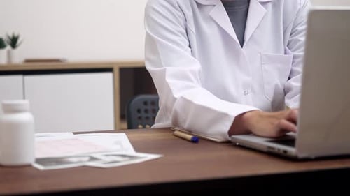 Close Up Dedicated Female Doctor Working Typing on Laptop Conducts Video Consultations