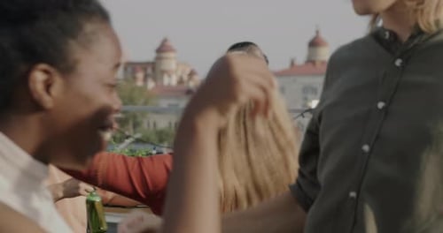 Friends Dancing at a Rooftop Party in the City