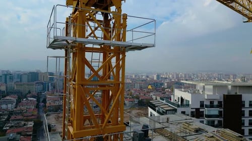 Tower crane working on a multi-story construction site