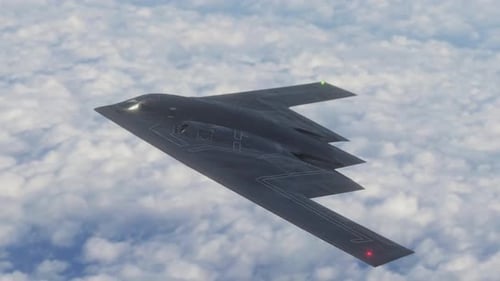 Stealth Bomber B-2 Spirit Aircraft Flying Above Clouds
