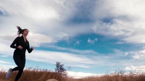 Woman Running on Trail Outdoors