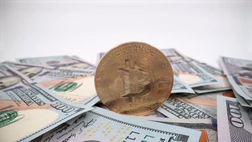 United States Dollar (USD) banknotes and bitcoin close up 4K