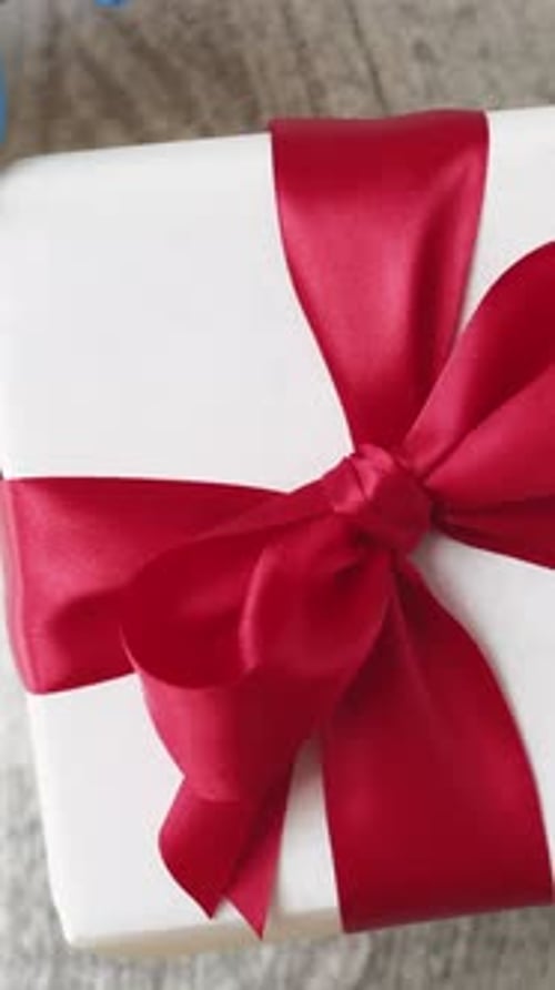 Festive Wrapped Birthday Gift with Red Ribbon