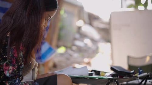 Woman Paints Custom Design on Shoes
