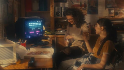 Young Man And Woman Eating Lunch In Retro Office