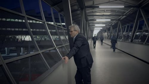 Man on an Overpass at Night