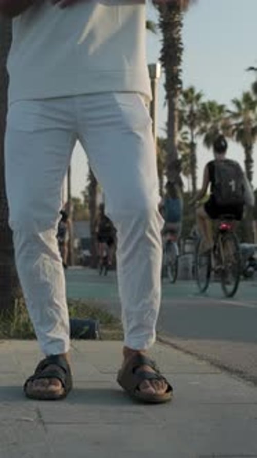 Bottomup Shot of a Man Dancing Bachata Outdoors in the City Street