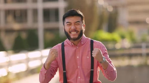Excited Man Pumping Fists in Celebration