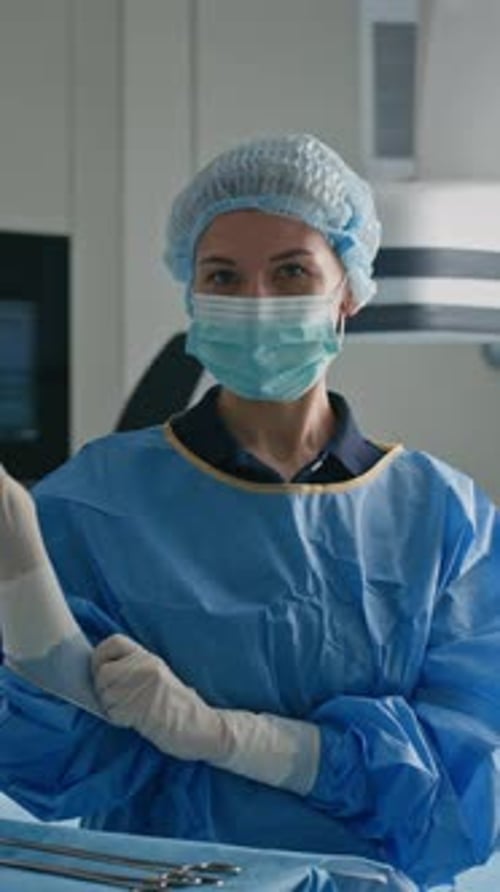 Female Surgeon Adjusting Latex Gloves