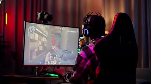 Asian Boy Streamer Celebrating Winning Game On Computer. Live Stream Video Game