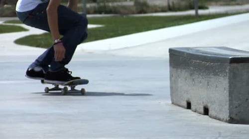 Skateboarder Does a Trick and Falls 16-19