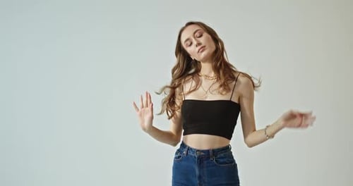 Young Woman Posing Fashionably in Studio