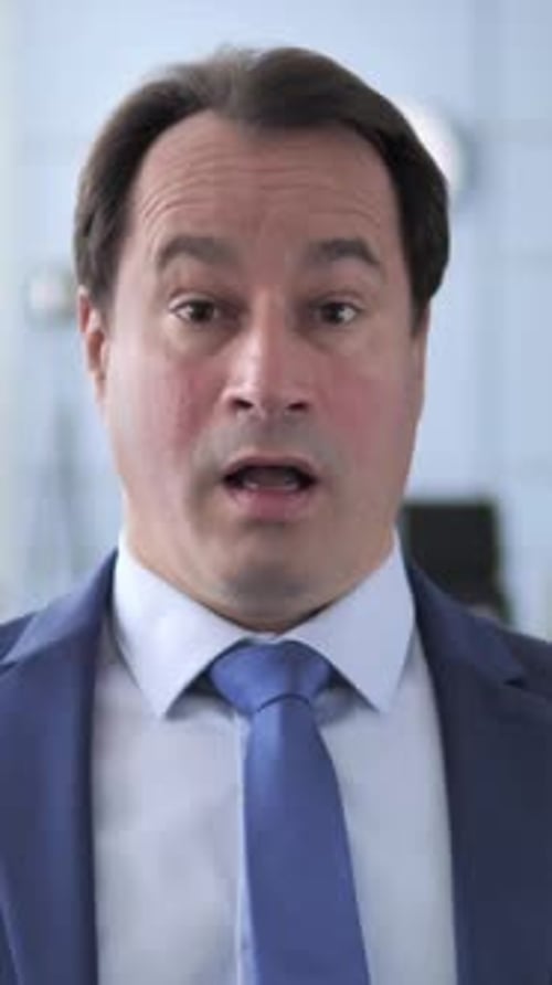 Man in Suit Looking at Camera