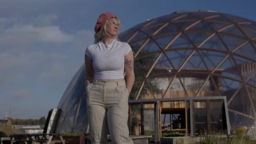 Stylish Woman Standing Outside Dome Structure