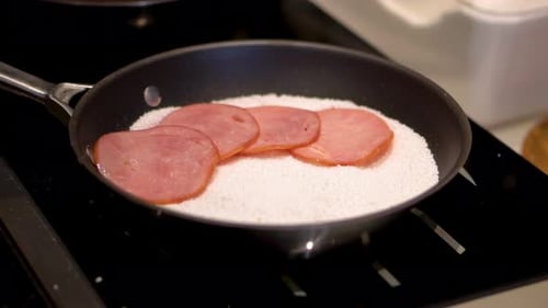 Ham Being Placed on Food Base in Pan