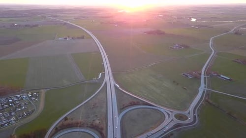Aerial View of Freeway Intersection with Moving Traffic Cars