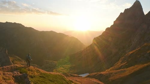Male Hiker Stand On Viewpoint With Sunset Panorama