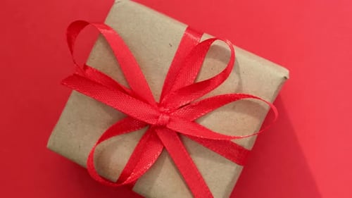 Brown Paper Christmas Gift with Red Satin Ribbon
