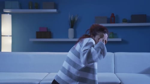 Woman looking at camera with coward expression.