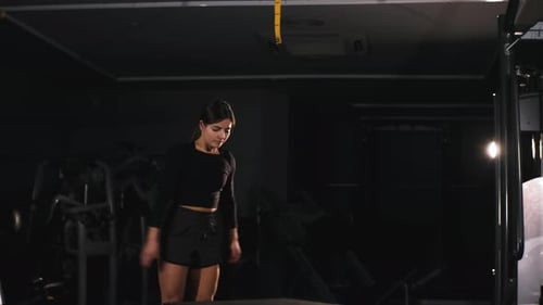 Strong Woman with Perfect Fitness Body in Sportswear Doing Set of Jump on Wooden Box Jumps at Gym