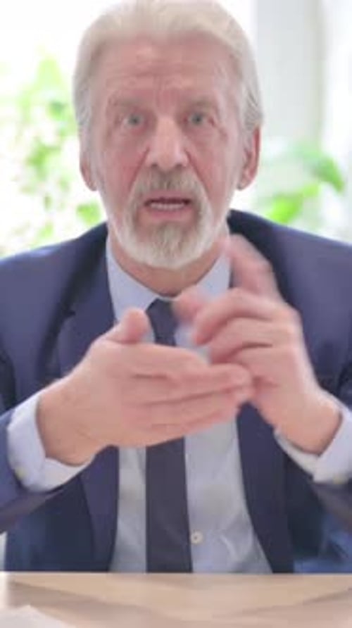 Online Video Chat Senior Old Businessman in Office, vertical video