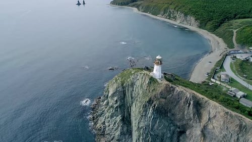 Aerial Tilt View of an Old Lighthouse on the Cliff on Pacific Coast Beautiful Panoramic Seascape