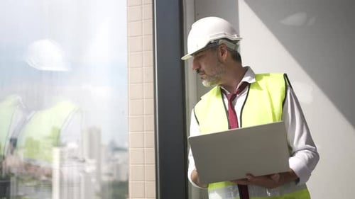 Engineers work in high rise building.