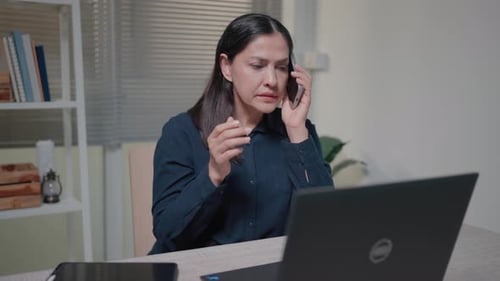 Woman using a smartphone Feeling dissatisfied with lost data Poor internet connection Bad equipment