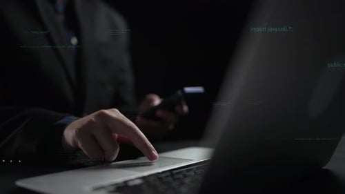 Businessperson Working on Laptop with Code and Data Visualization in Background, Focus on Hands and