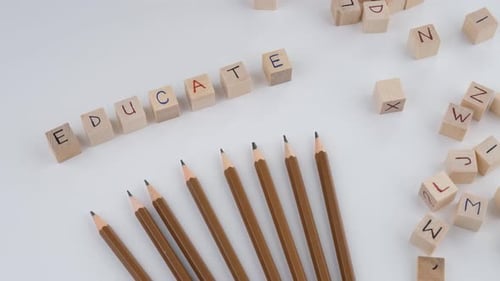 Education Blocks and Pencils on White Background