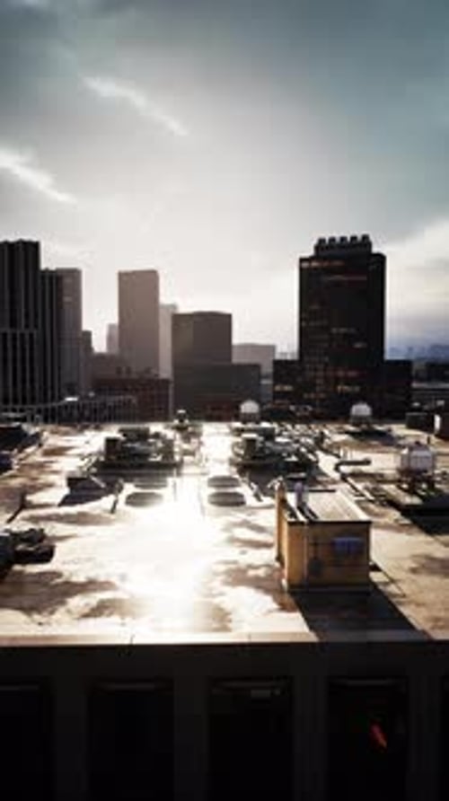 Vertical Pan Over Modern City Rooftop Skyline