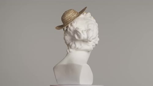 Closeup Shot Ancient Marble Bust Statue of Roman Era Woman in Small Straw Hat Spinning on a Platform