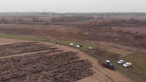 Tractor works in the field doing tillage in Ukraine