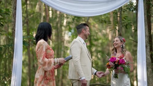 Happy Bride And Groom Smiling At Colorful Wedding Ceremony Altar In Outdoor Forest, 4K Slow Motion