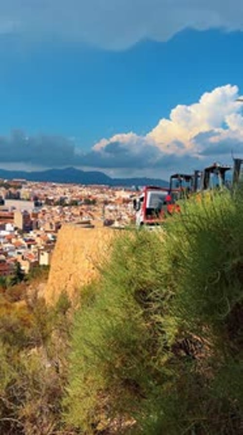 Panoramic city view from a stone fortress wall in Spain.