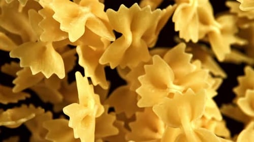 Farfalle Pasta Abstract Close-Up on Black Background