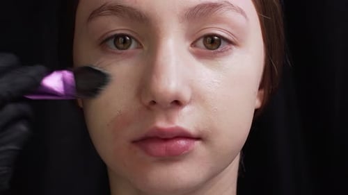 Makeup Artist Does Makeup to Client