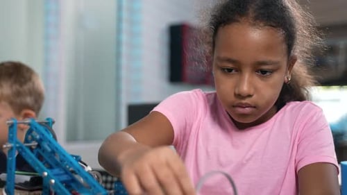 Children Building Robot in Classroom for Science Project