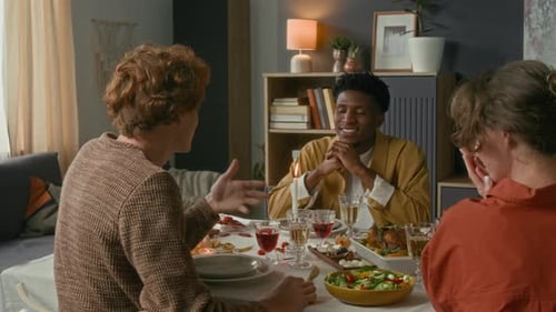 Diverse Friends Gather for Dinner Party at Home