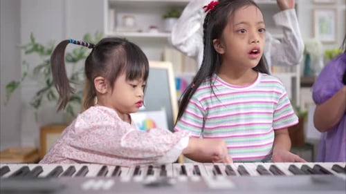 Kids Learn Piano Keyboard in Classroom Setting