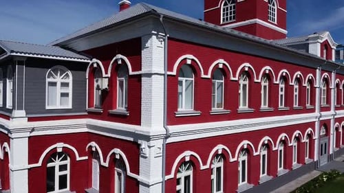 Elegant Historical Building with Red Facade and White Decor