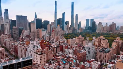 Approaching variegated buildings in the residential area along the stunning Central Park.