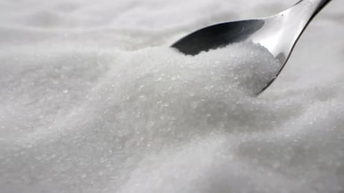 Table Sugar in a Spoon