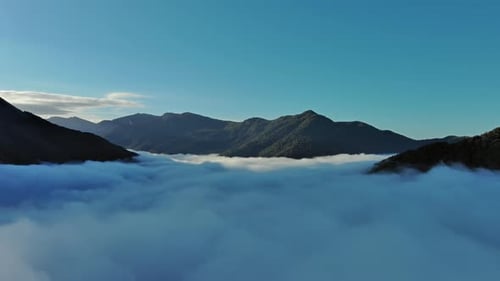 Aerial View of Clouds and Mountains at Sunrise
