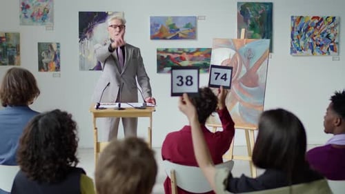 Art Auctioneer Leading Event in Gallery