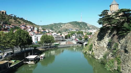 Aerial footage of Kura River during the summertime in Tbilisi