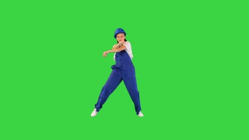Young Female Construction Worker Dancing on a Green Screen Chroma Key