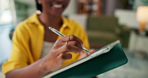 Woman Using Stylus with Tablet Device Indoors
